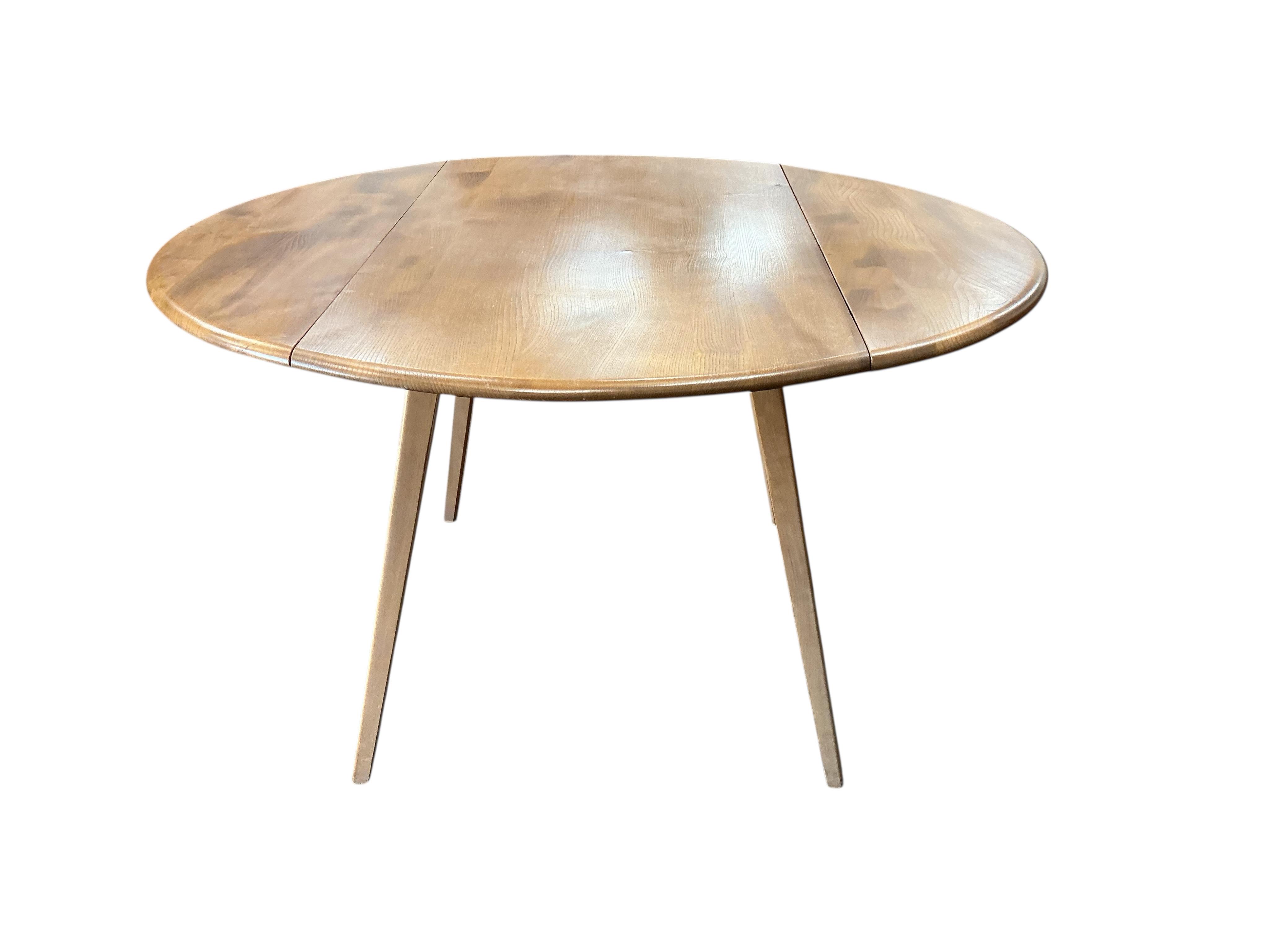 An Ercol light elm drop leaf dining table, width 112cm, depth 64cm, height 72cm